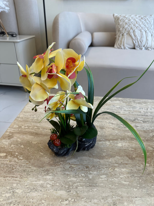 Yellow orchids flower arrangement