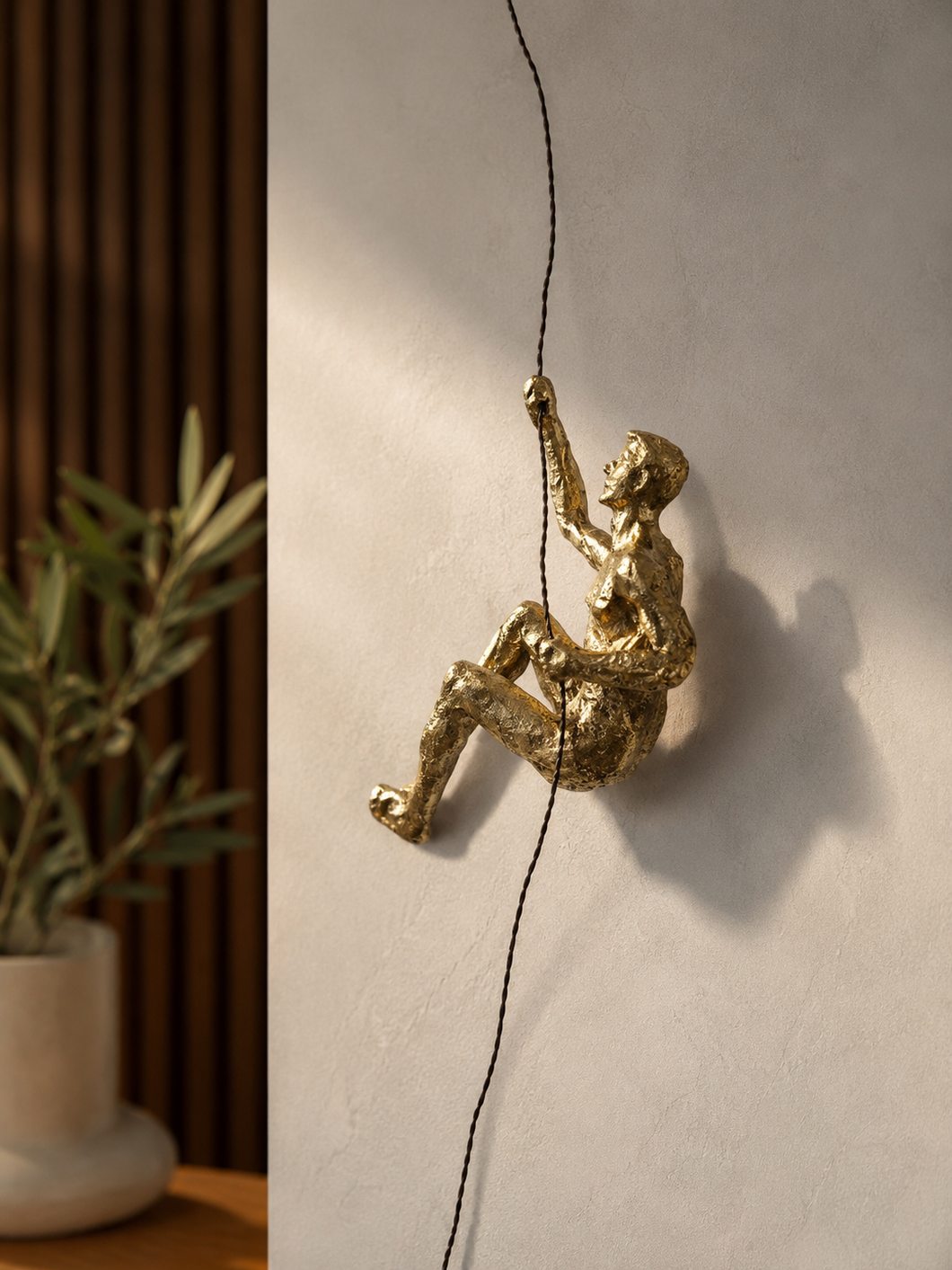 Climbing Man Sculpture Gold