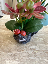 Maroon orchids flower arrangement