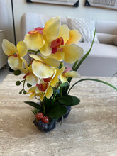 Yellow orchids flower arrangement
