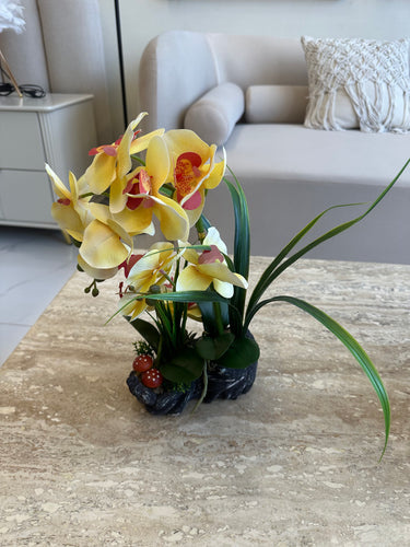 Yellow orchids flower arrangement