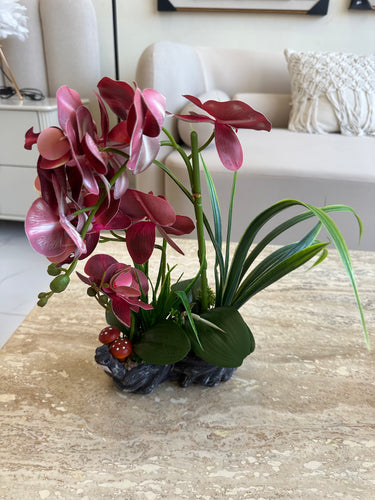 Maroon orchids flower arrangement